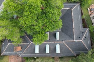 Newly installed architectural shingle roof with clean ridge lines and updated flashing in the West Georgia area.